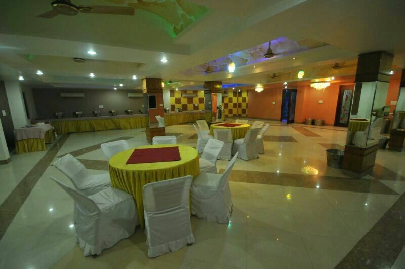 The banquet hall, empty and lit.