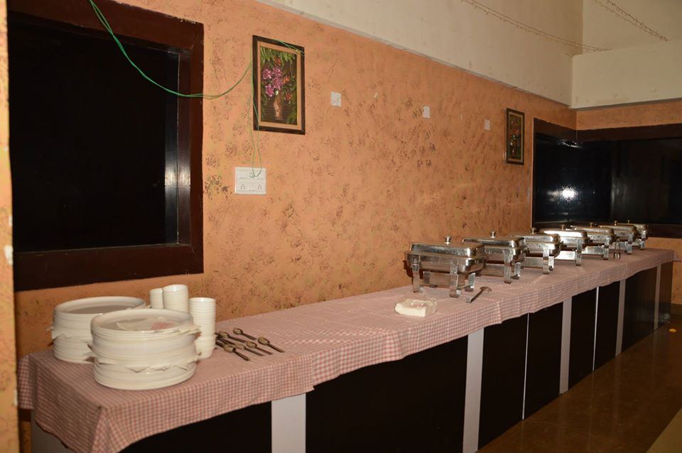 Tables and covered chairs in the hall.