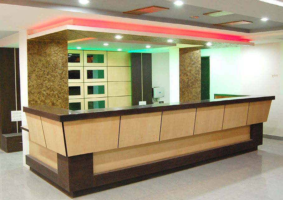 The reception desk in the hotel lobby.