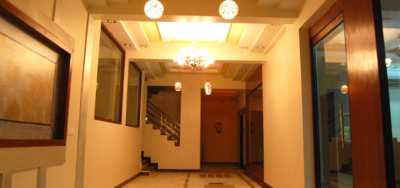 The lit ground-floor corridor and stairs.