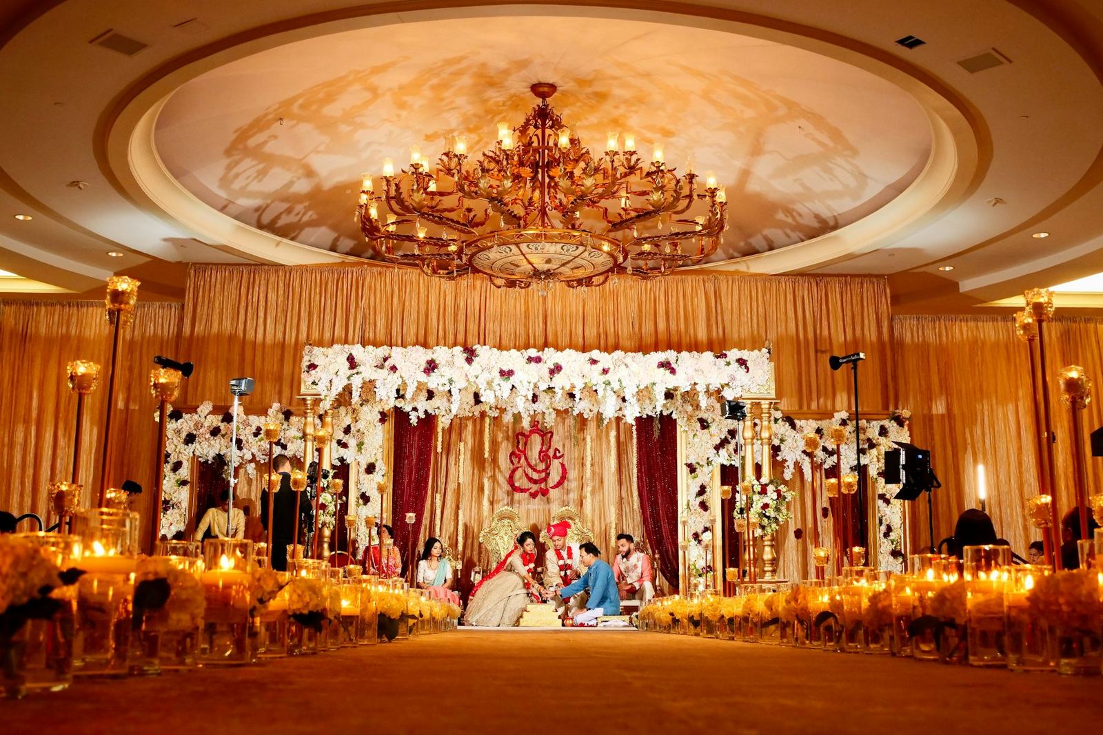 A couple performing a wedding ritual.